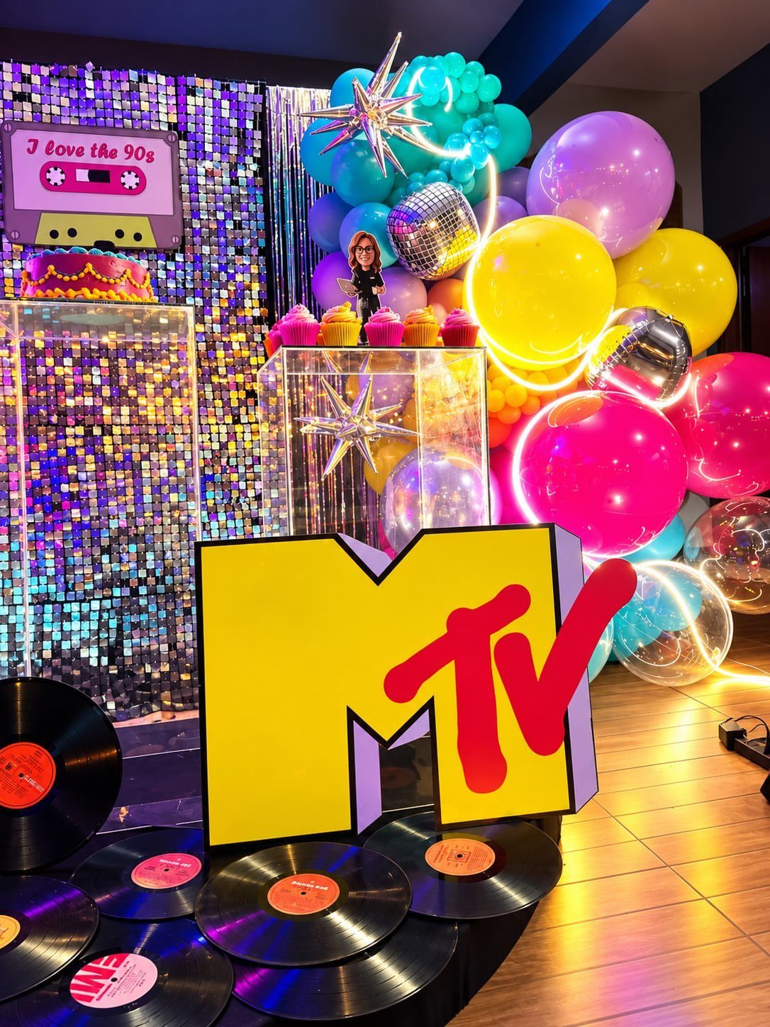 MTV logo and colorful balloons with vinyl records for a 90s themed party