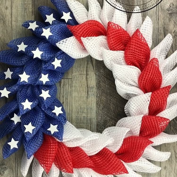 Patriotic mesh wreath with red, white, and blue colors and white stars.