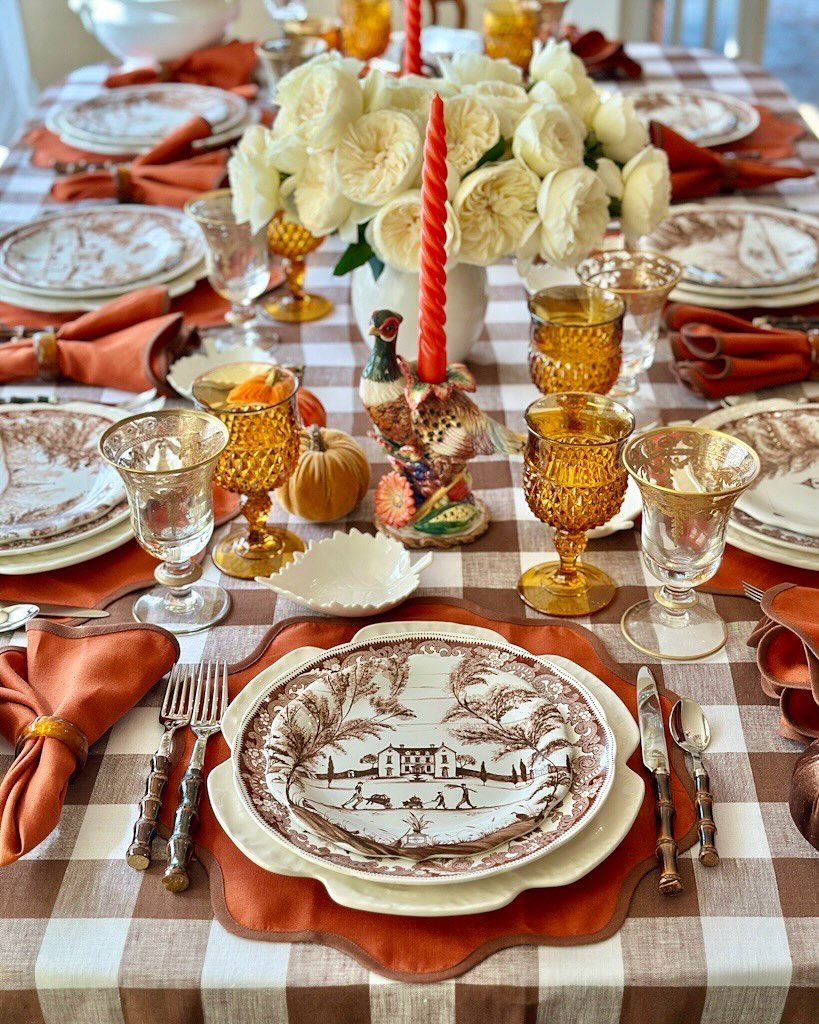 Brown and white buffalo check tablecloth with vintage plates and autumn table decor