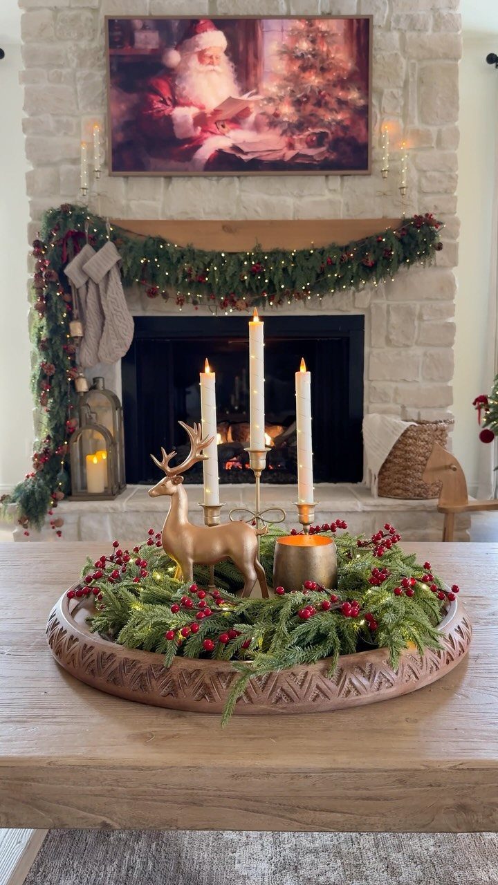 Christmas centerpiece with greenery and gold reindeer on a wooden coffee table