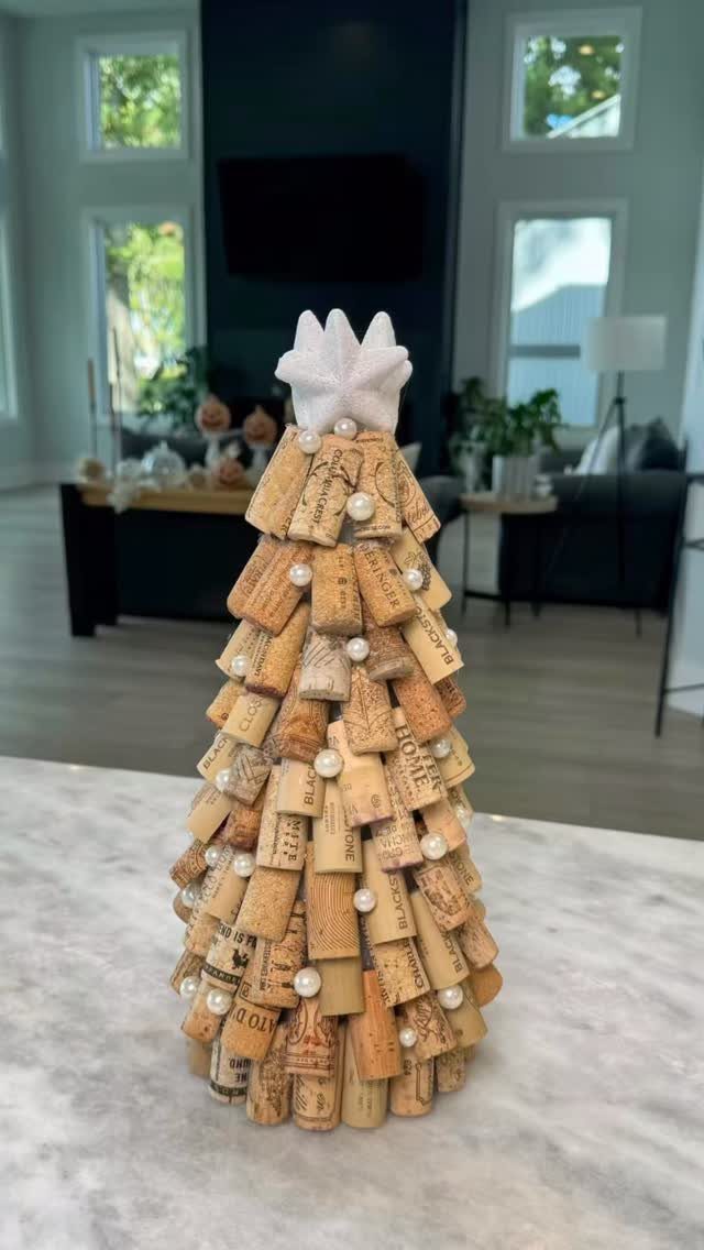Small Christmas tree made of wine corks with pearl beads and white star topper.