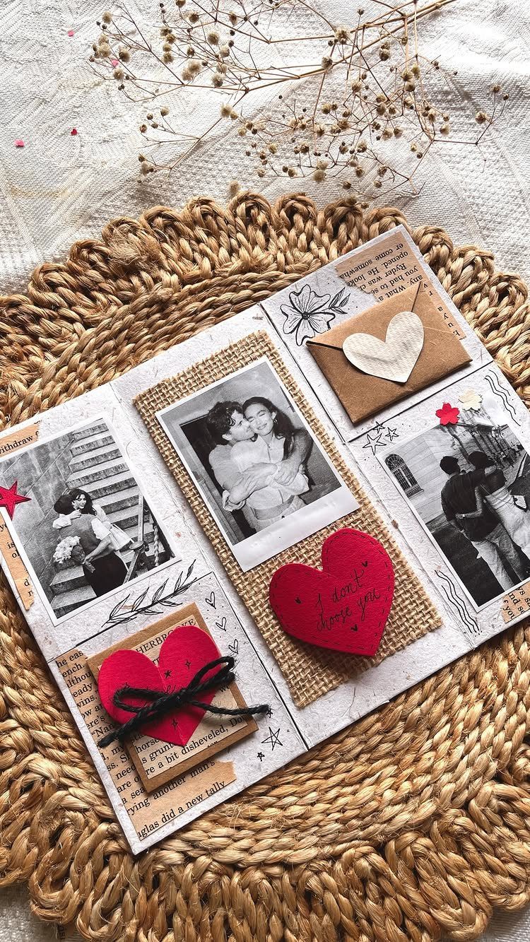 Handmade scrapbook page with couple photos, red hearts, and notes on straw mat.