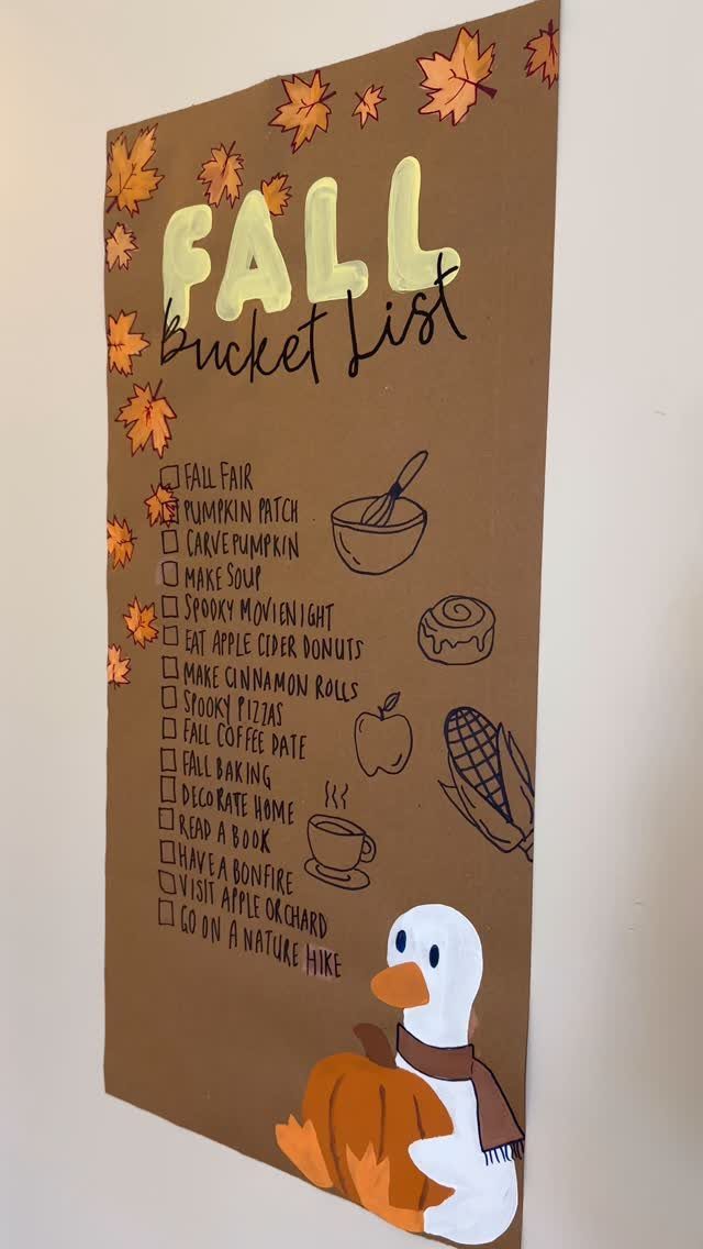 Brown fall bucket list sign with a checklist, autumn leaves, and a duck.