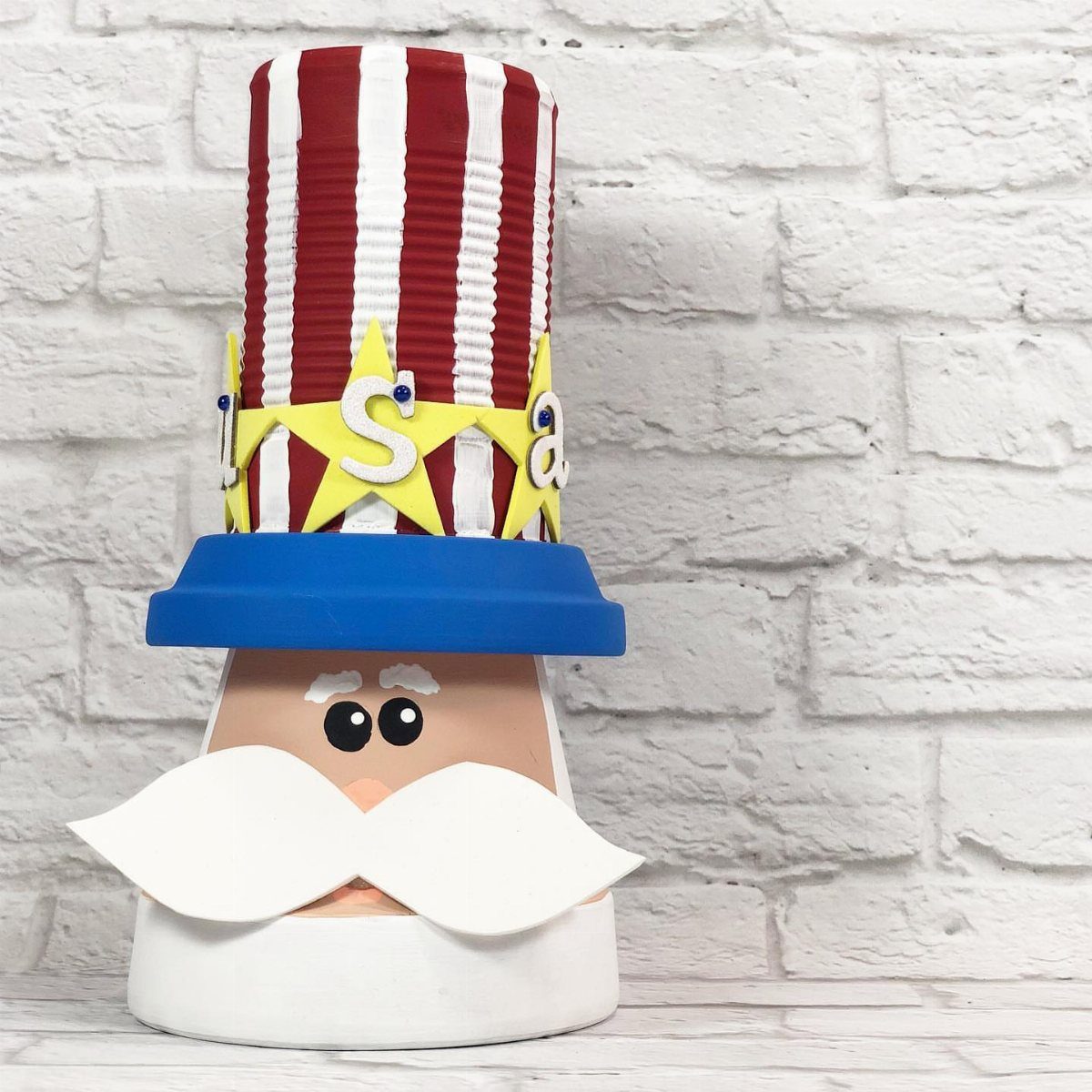 Uncle Sam craft figure made from a painted pot and paper decorations