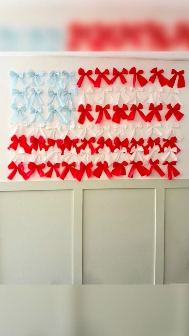 American flag wall decoration made from red, white, and blue ribbons