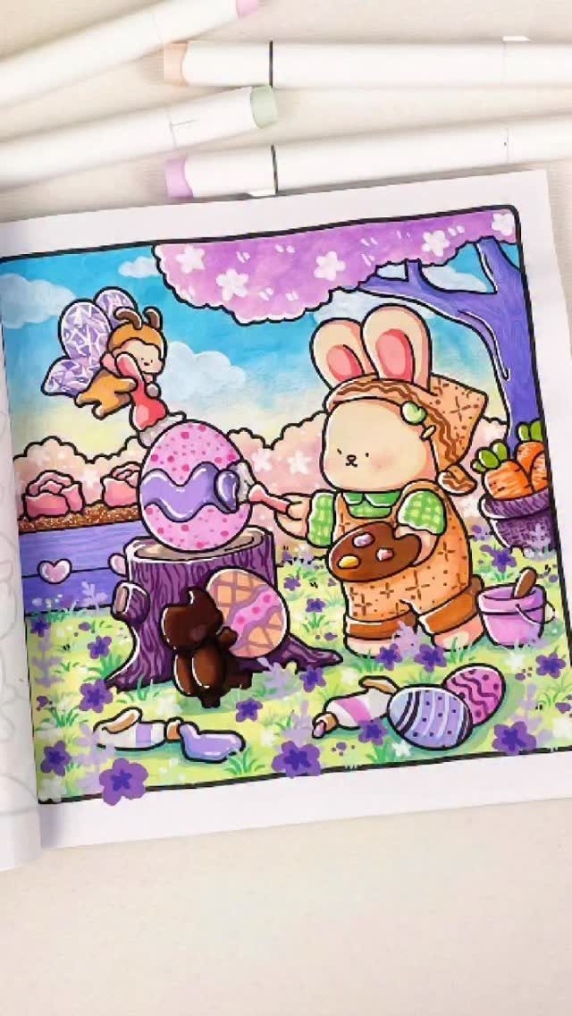 Colored Easter coloring page featuring a bunny painting a large purple egg.
