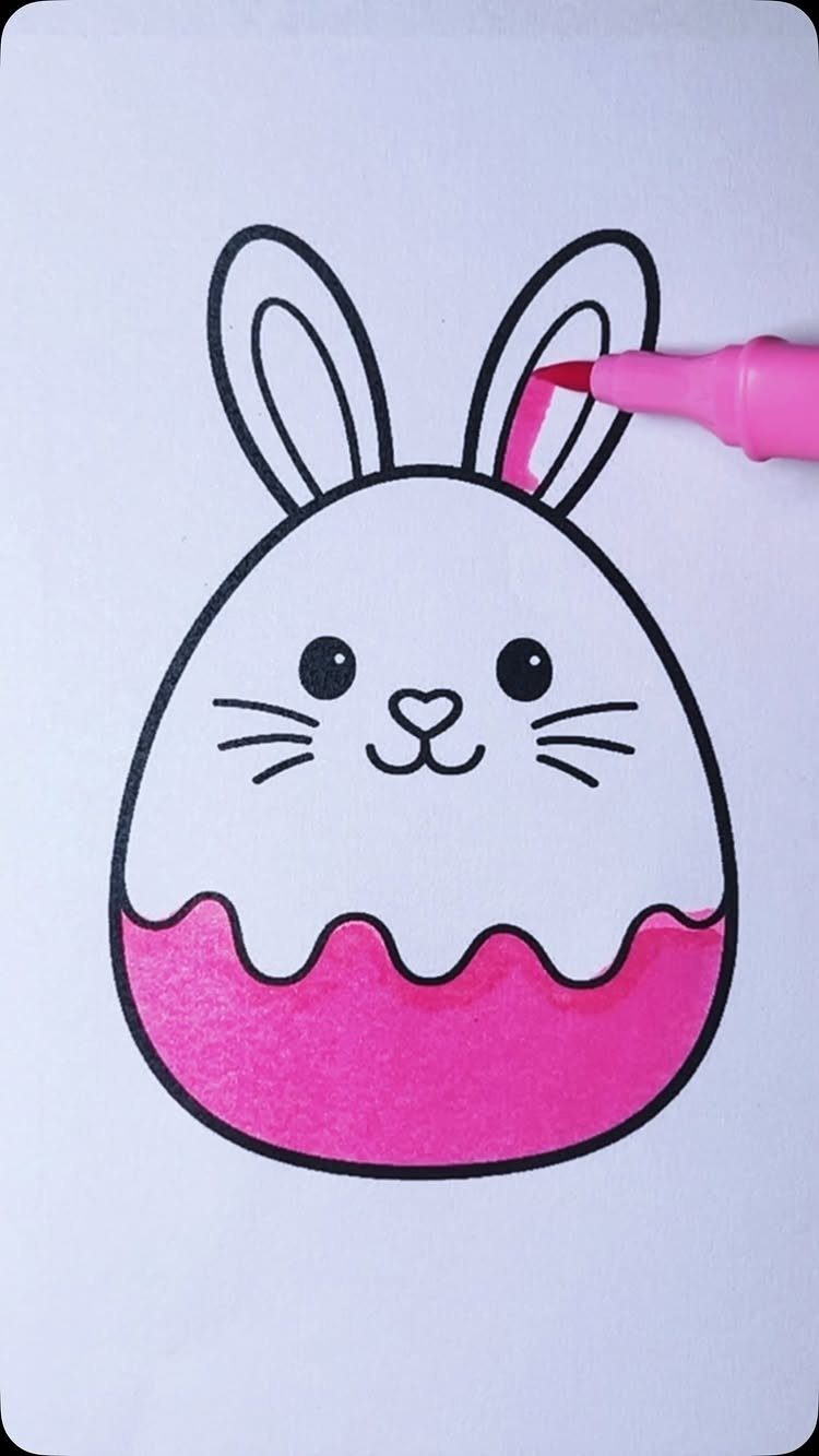 Bunny shaped Easter egg coloring page being filled in with a pink marker