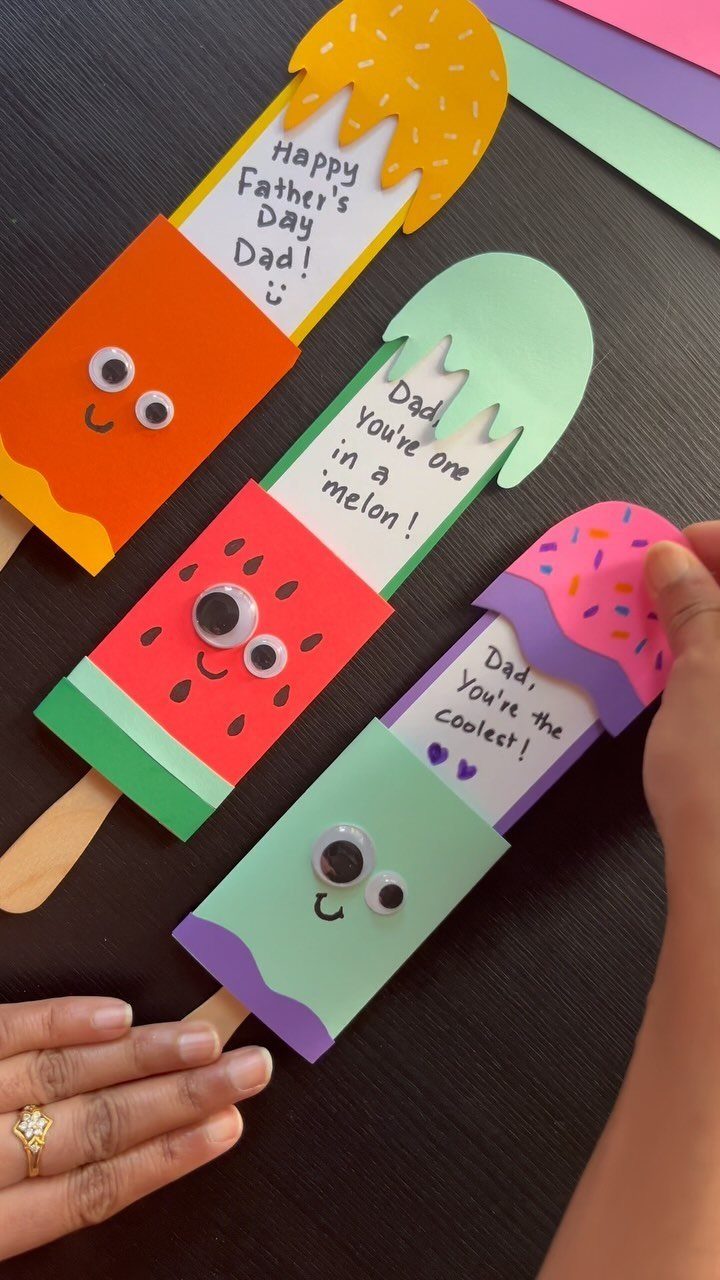 Three colorful popsicle-shaped Father's Day cards with googly eyes and handwritten messages.