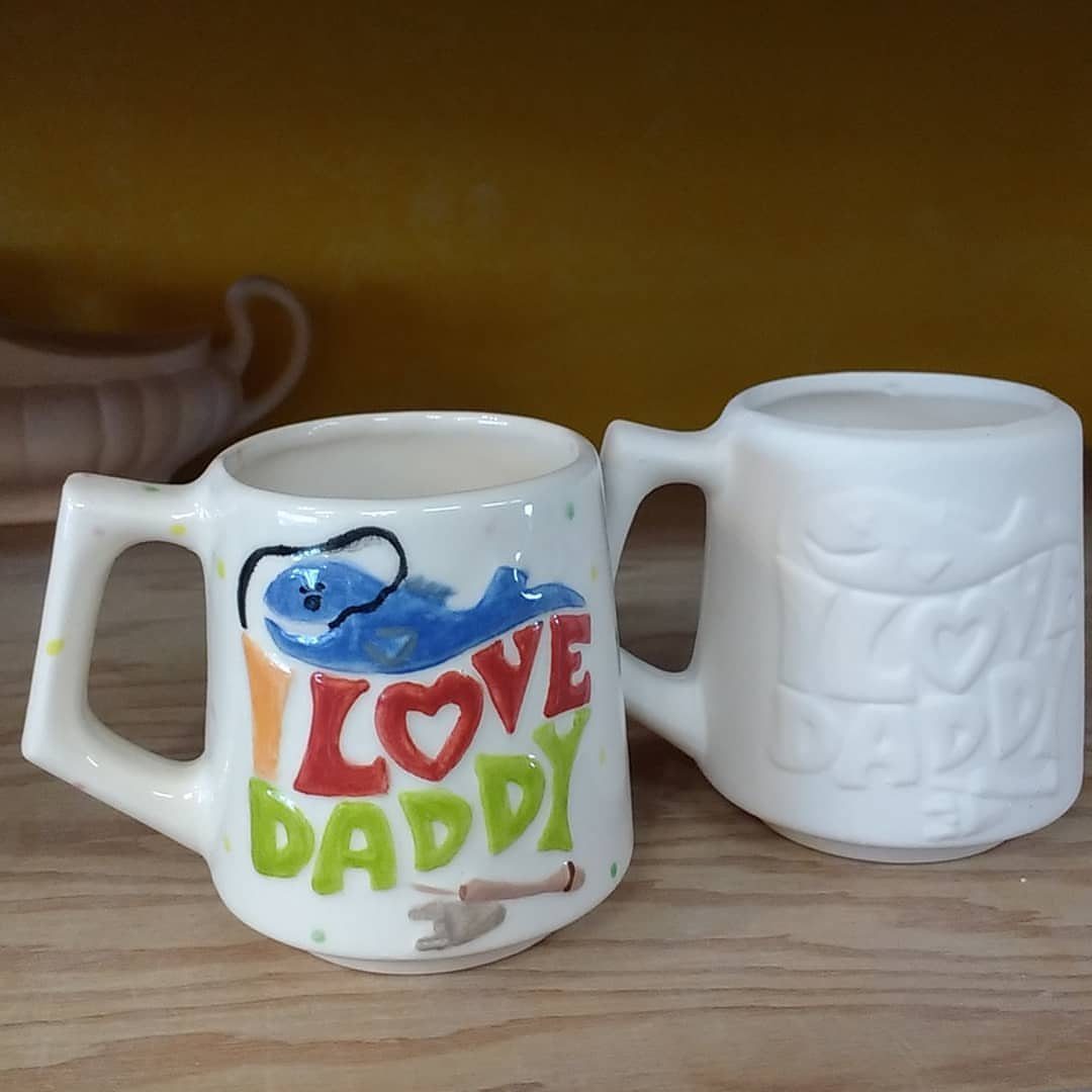 Two ceramic mugs, one hand-painted with a blue whale and I LOVE DADDY text.