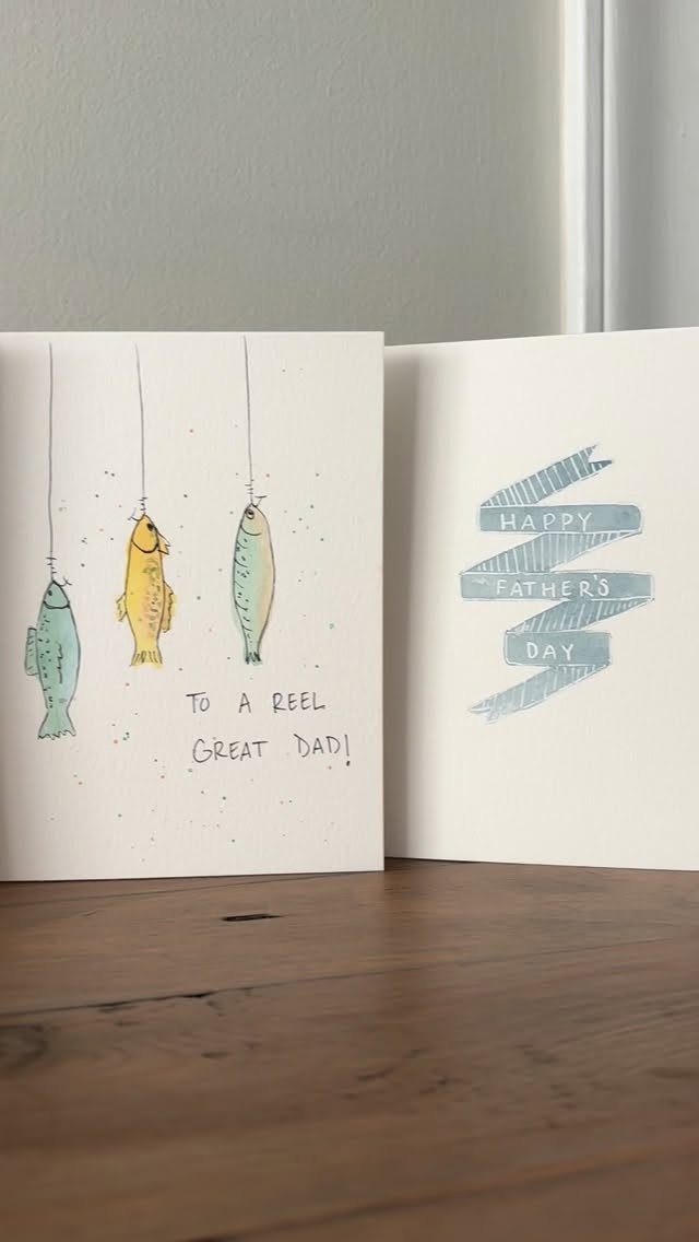 Open Father's Day card with fish illustrations and a blue ribbon graphic.