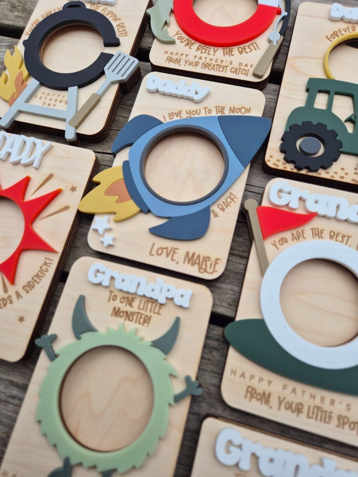Wooden Father's Day plaques for Grandpa with colorful rocket and monster cutouts