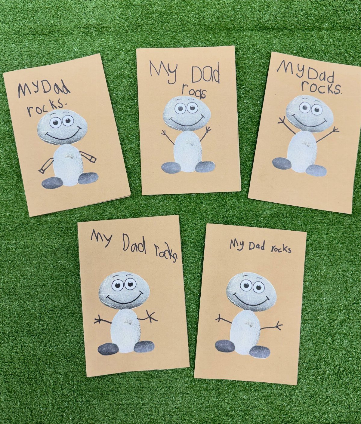 Five handmade Father's Day cards with small rocks and the text My Dad rocks