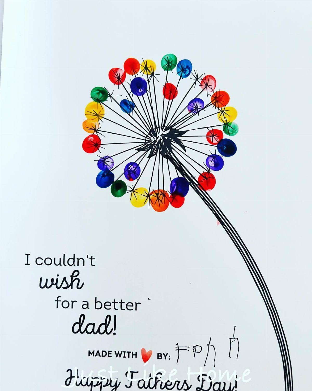 Colorful fingerprint dandelion on a Father's Day card with handwritten heartfelt message