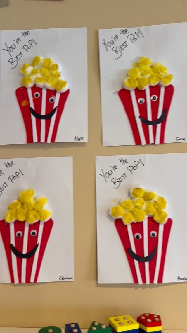 Four handmade popcorn bucket cards with yellow pom-poms and Best Pop text