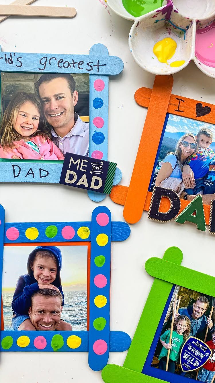 Colorful popsicle stick picture frames holding photos of fathers and children with paint palettes.