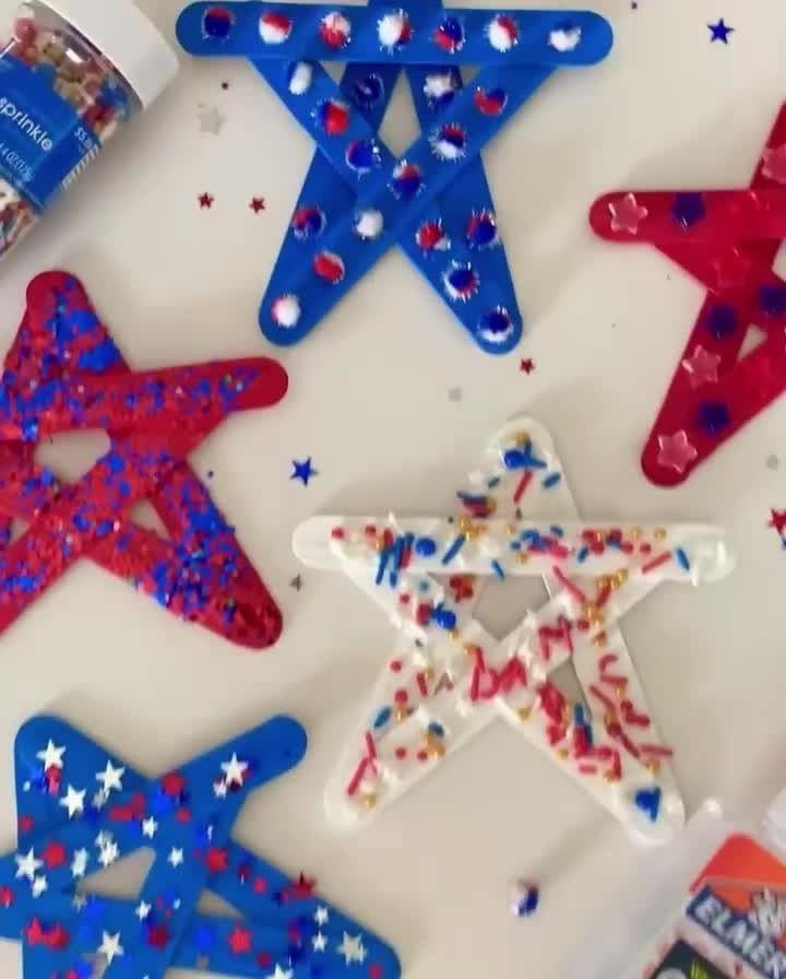 Red, white, and blue stars made from painted clothespins decorated with glitter.