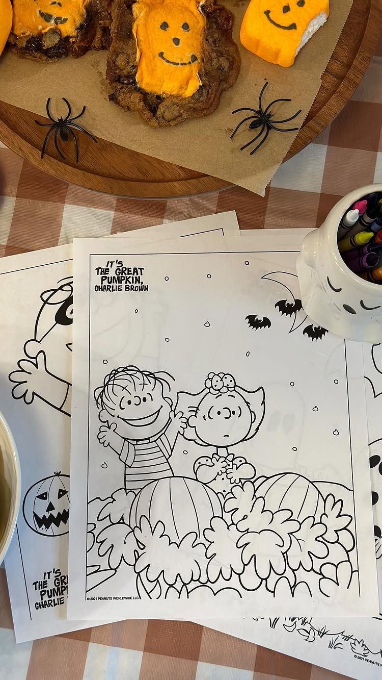 Peanuts characters coloring pages with pumpkin cookies and spiders on a table