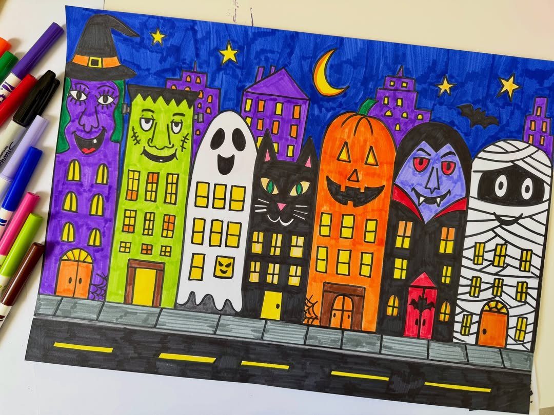 Halloween themed buildings drawing colored with markers on a white paper background