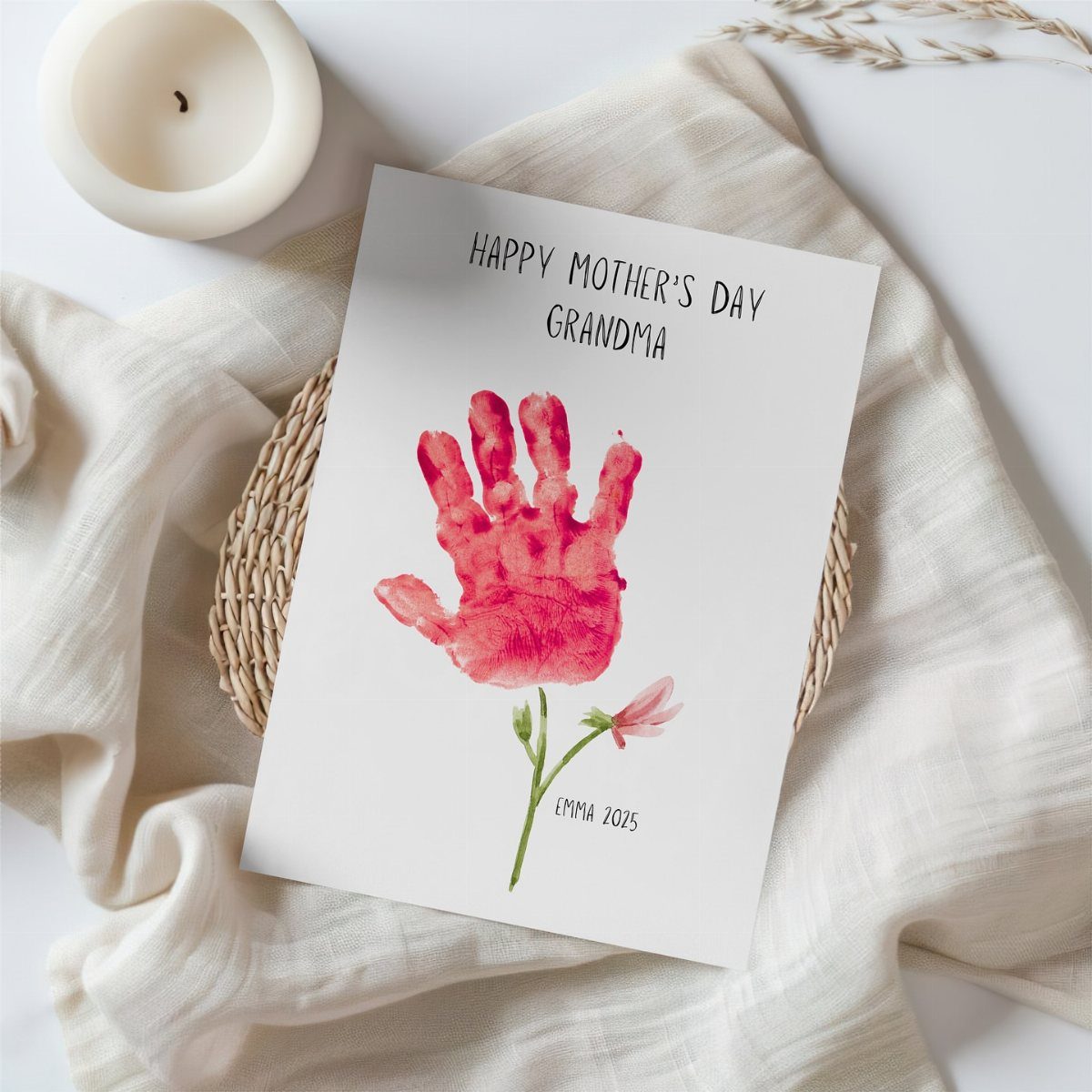 Handprint card for Mother's Day featuring a red handprint flower on white paper.