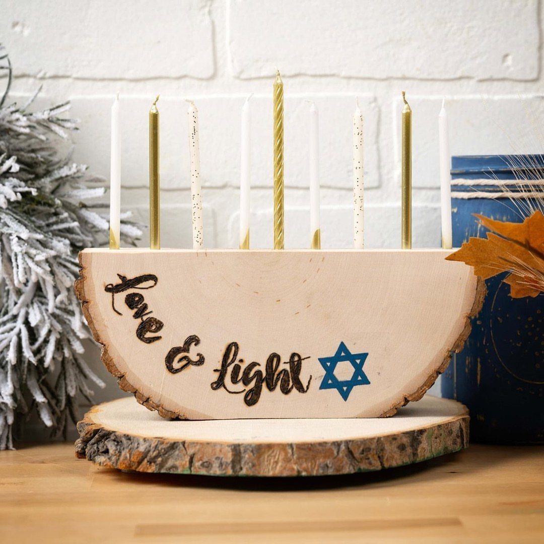 Wooden menorah carved from a log slice with candles and a blue Star of David