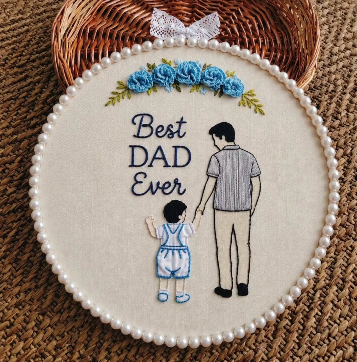 Embroidered hoop art showing a father and son with Best Dad Ever text.