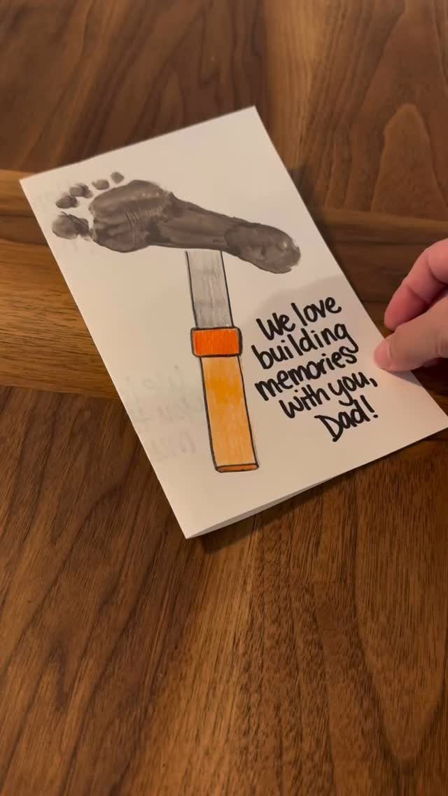 Handmade Father's Day card featuring a hammer made from a grey footprint.