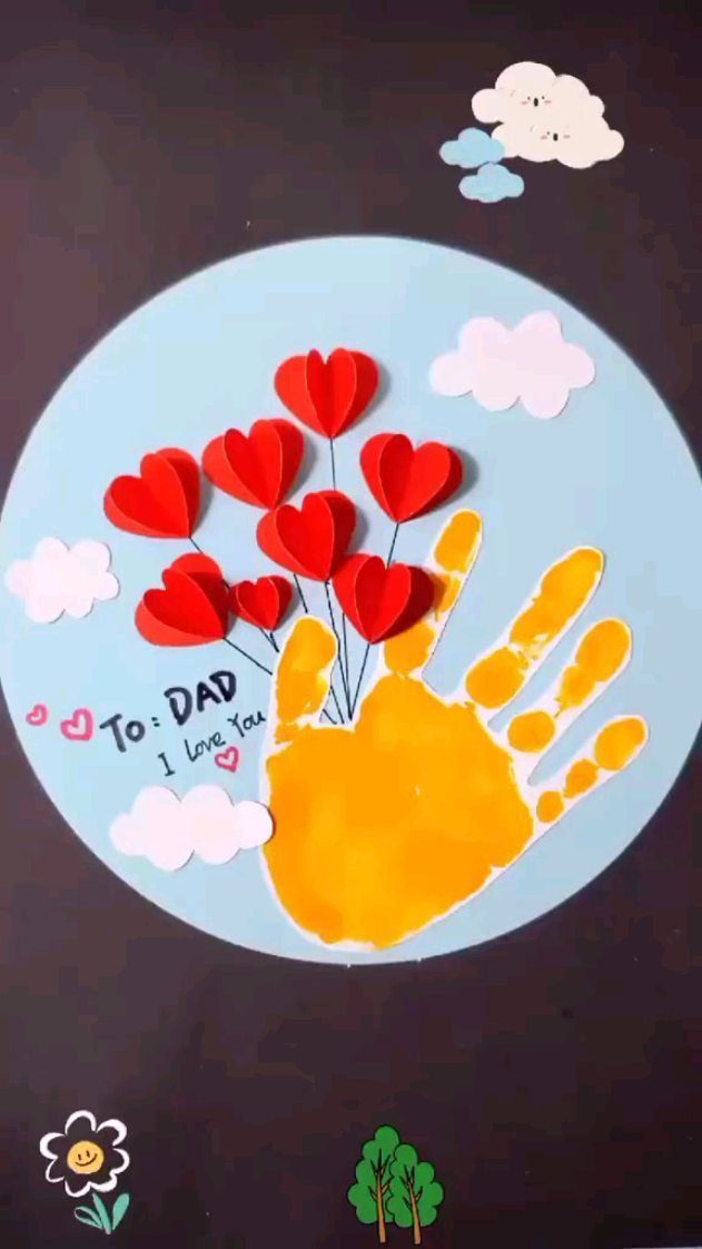 Yellow handprint craft with red paper hearts and clouds for Father's Day.