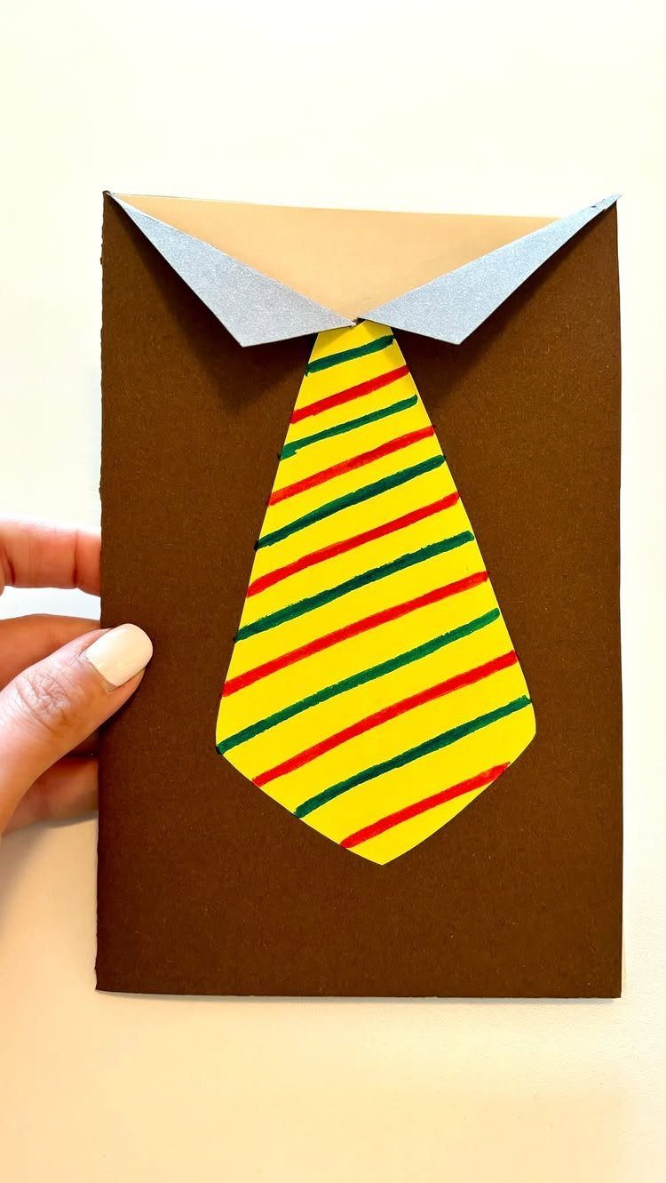 Brown cardstock greeting card featuring a white collar and striped yellow paper tie.