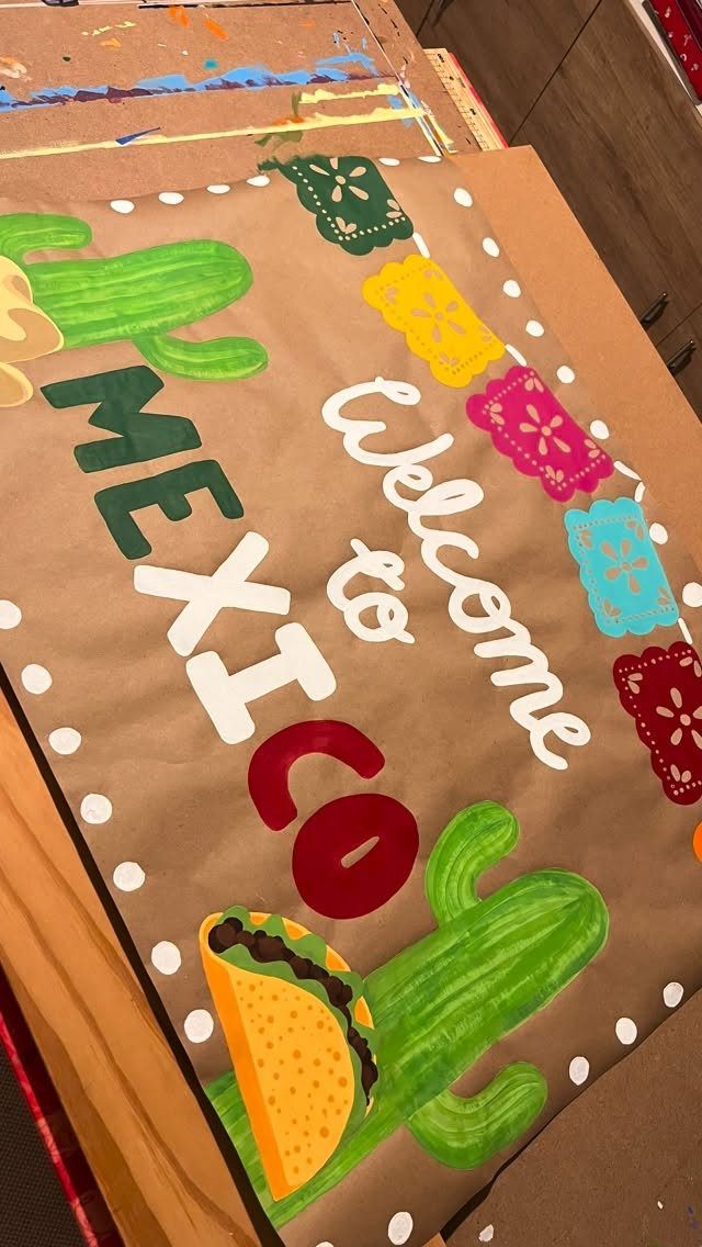 Brown paper banner with Welcome to Mexico text, cacti, and colorful papel picado.