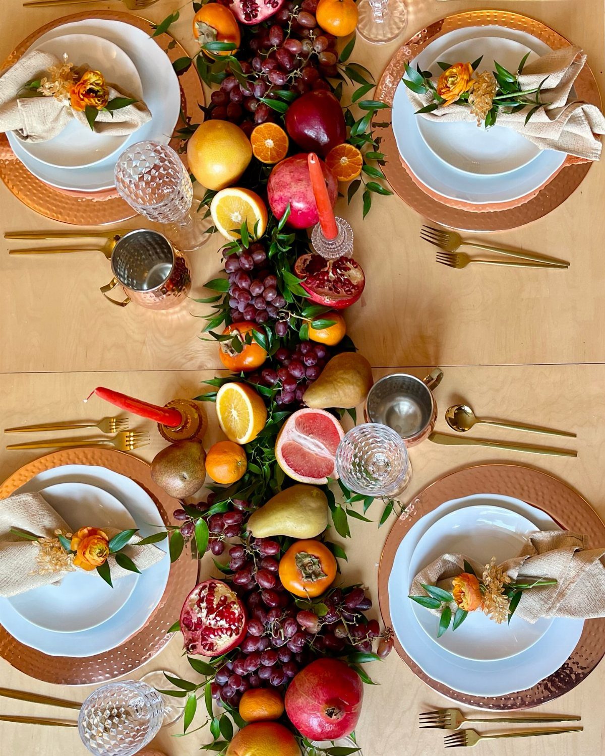 Fruit centerpiece with pears and grapes on a modern thanksgiving table setting