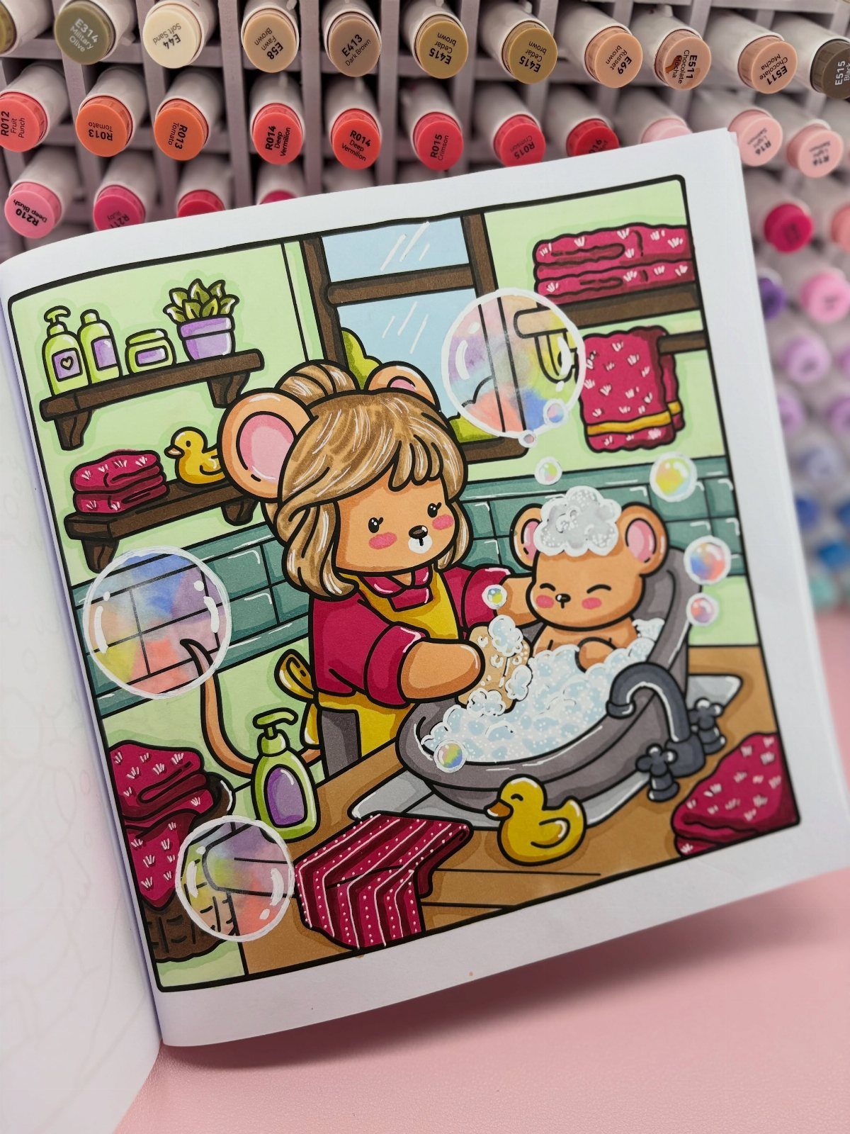 Mother mouse bathing a baby mouse in a bubble bath coloring page.