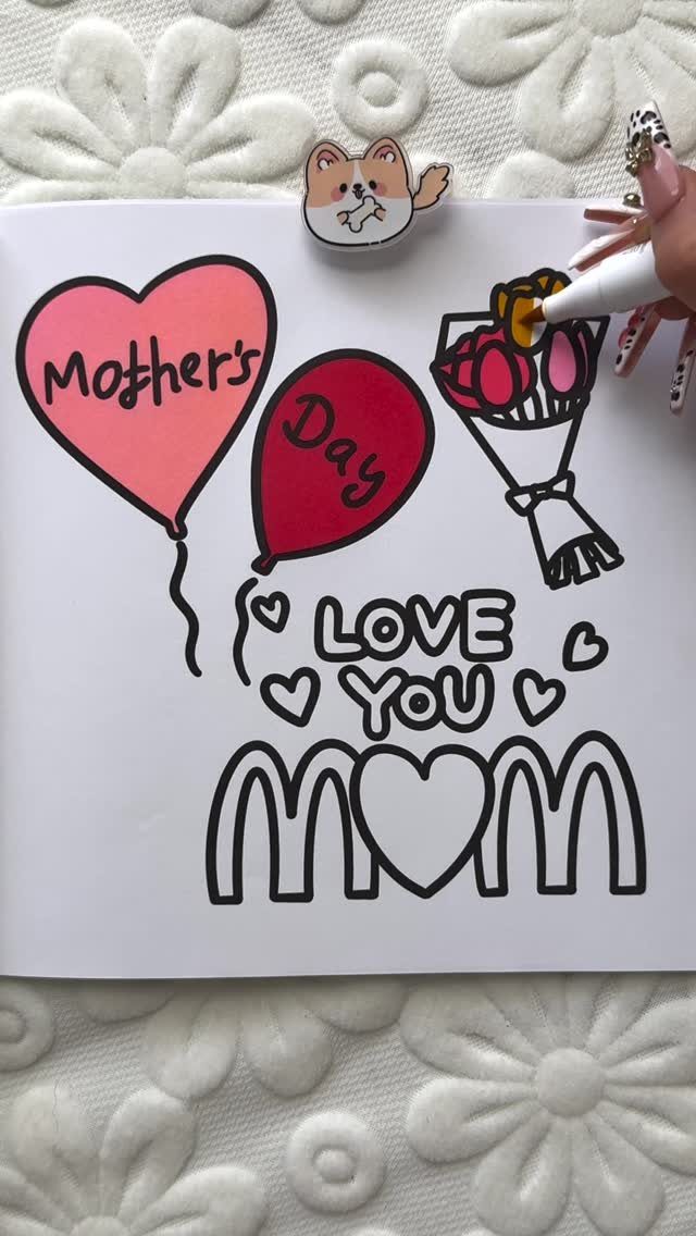 Hand coloring a Mother's Day card with balloons and a flower bouquet.