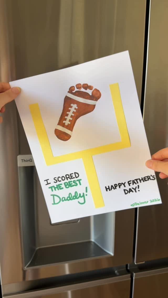 Father's Day card with a football footprint on a yellow goalpost held up.