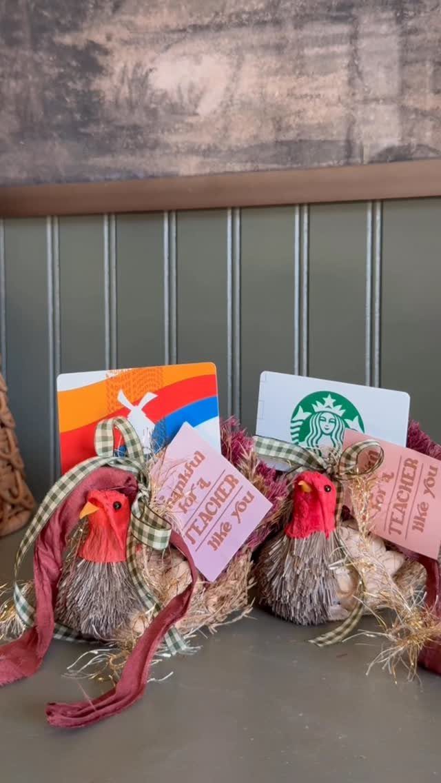 Two decorative straw turkeys with gift cards and pink teacher appreciation tags.