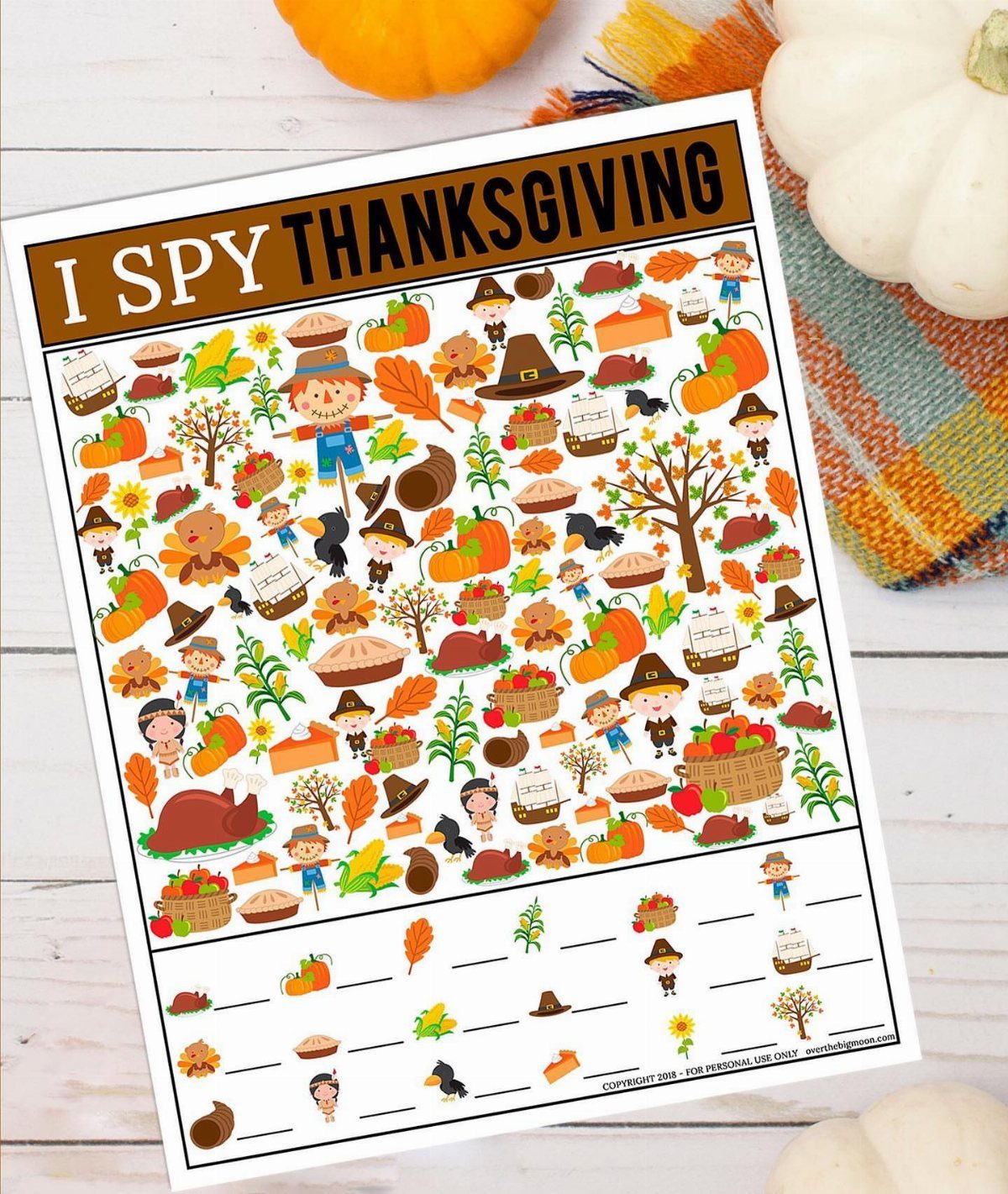 I Spy Thanksgiving game sheet with autumn illustrations and pumpkins on wooden background