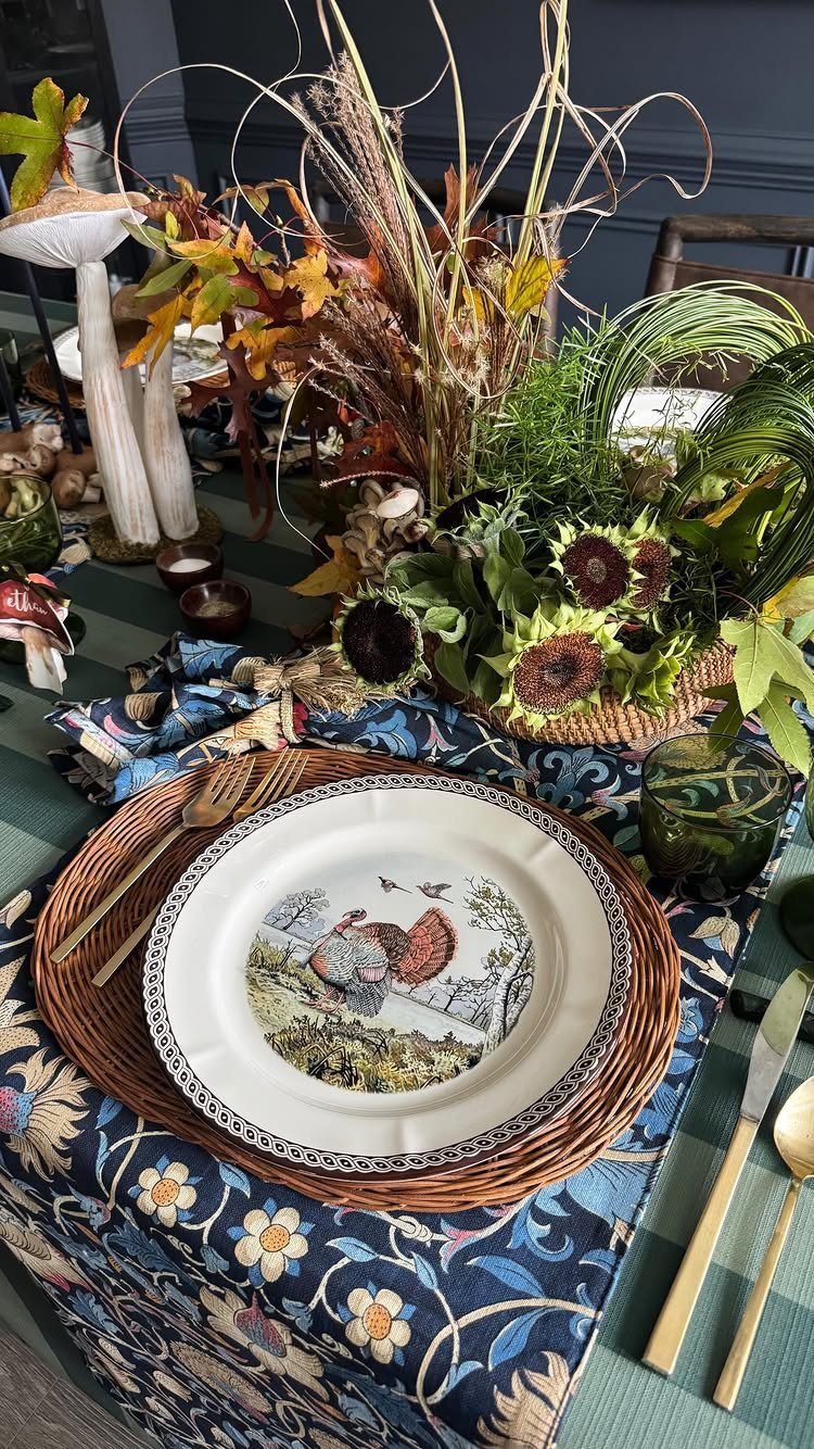 Turkey plate on a woven charger with layered floral and green table runners.